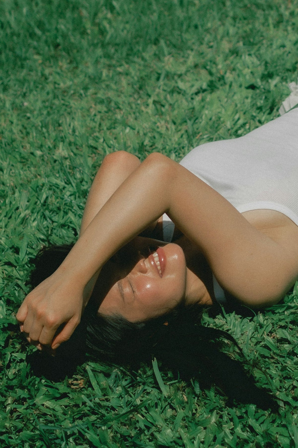A woman resting in the sun on a hot UK summer day