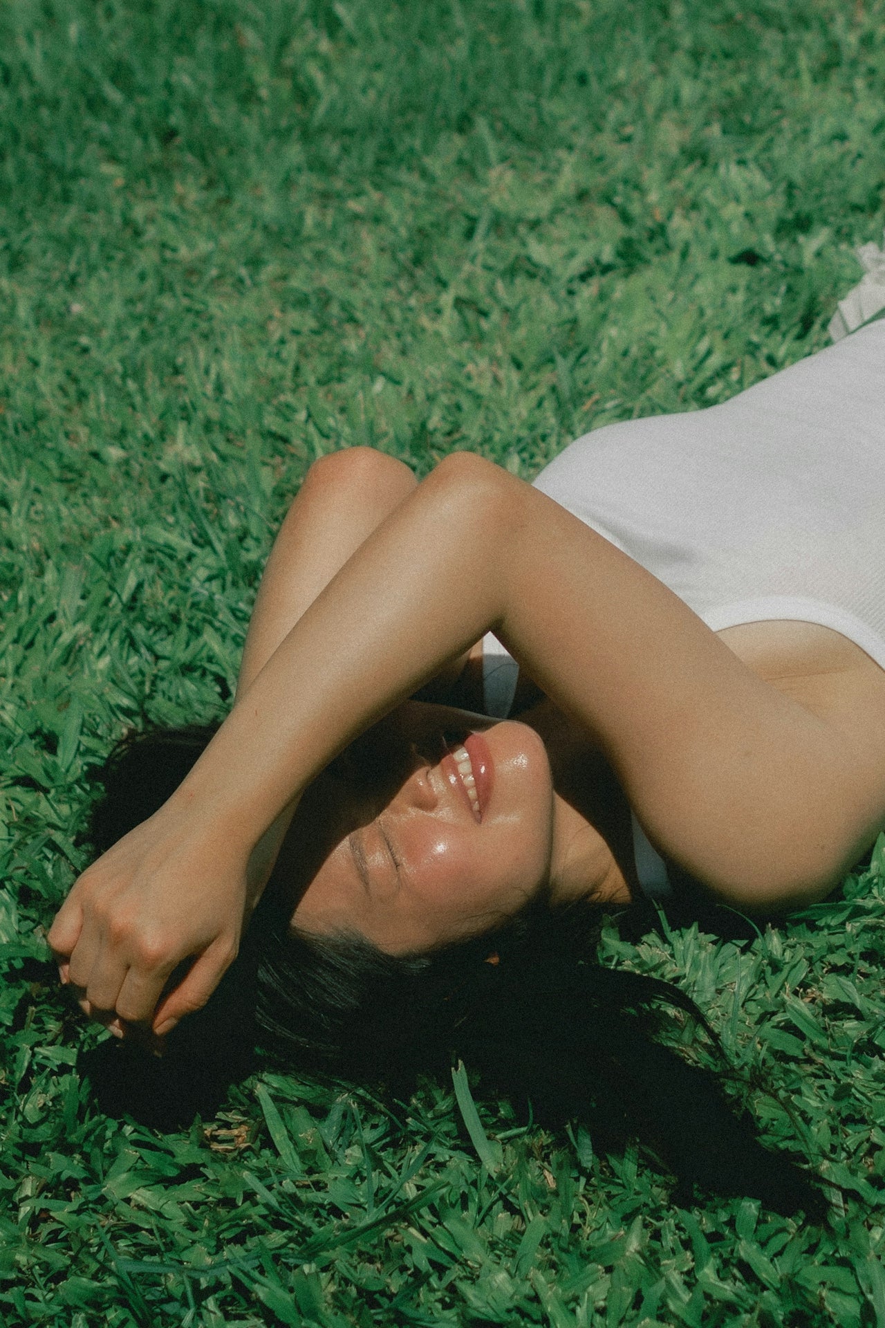 A woman resting in the sun on a hot UK summer day